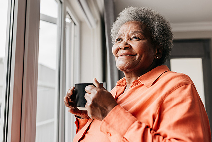 woman looking out window 