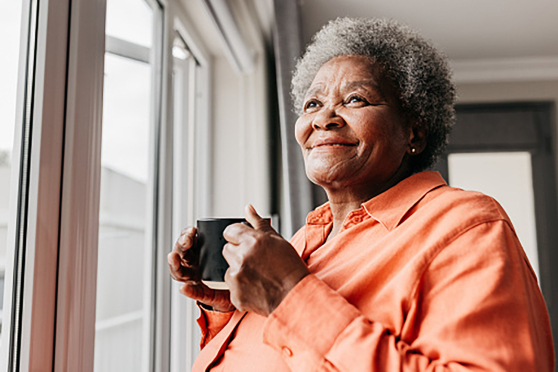 woman looking out window 